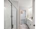 Bathroom featuring a double vanity, tiled floors, and glass shower at 2800 Elsa Dr, Raleigh, NC 27610