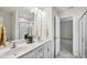 Bathroom featuring double sink vanity, quartz countertops, and tiled floors at 2800 Elsa Dr, Raleigh, NC 27610
