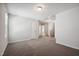 Spacious bedroom with plush carpet and multiple entryways at 2800 Elsa Dr, Raleigh, NC 27610
