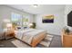 Bedroom featuring natural wood furniture, neutral paint, and a view from the window at 2800 Elsa Dr, Raleigh, NC 27610