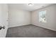 Bedroom featuring neutral paint, carpeted floors, and one window at 2800 Elsa Dr, Raleigh, NC 27610