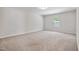 Spacious bedroom with neutral carpet flooring and natural light from the window at 2800 Elsa Dr, Raleigh, NC 27610