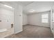 Bright bedroom showcasing neutral walls, carpet flooring, and a walk-in closet with modern amenities at 2800 Elsa Dr, Raleigh, NC 27610