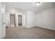 Large room with neutral carpet with hall and staircase access at 2800 Elsa Dr, Raleigh, NC 27610