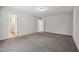 Spacious bedroom featuring neutral paint, carpeted floors, and a door to the bathroom at 2800 Elsa Dr, Raleigh, NC 27610