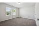 Bedroom featuring neutral paint, carpeted floors, and a view from the window at 2800 Elsa Dr, Raleigh, NC 27610