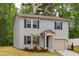 Charming two-story home with gray siding, black shutters, and a well-manicured lawn at 2800 Elsa Dr, Raleigh, NC 27610