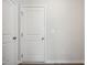 Bright hallway with white doors and neutral walls, showcasing the home's clean and modern aesthetic at 2800 Elsa Dr, Raleigh, NC 27610
