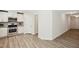 Kitchen featuring white cabinets, stainless steel appliances, and hardwood floors at 2800 Elsa Dr, Raleigh, NC 27610
