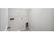 Laundry room with hookups and white wire shelving, ready for appliances at 2800 Elsa Dr, Raleigh, NC 27610