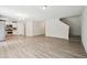 Bright open floor plan showcasing the living room with luxury vinyl plank flooring and modern chandelier lighting at 2800 Elsa Dr, Raleigh, NC 27610