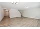 Spacious living room with hardwood floors, neutral walls, chandelier, and natural lighting at 2800 Elsa Dr, Raleigh, NC 27610
