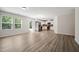 Spacious open floor plan showcasing the living room, dining area, and kitchen with stainless steel appliances at 2800 Elsa Dr, Raleigh, NC 27610