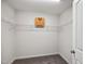 Walk-in closet with wire shelving and carpeted floors at 2800 Elsa Dr, Raleigh, NC 27610