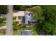 An aerial view shows a home with solar panels and meticulously landscaped yard with a detached garage at 2811 Van Dyke Ave, Raleigh, NC 27607
