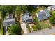Bird's eye view of home with solar panels and beautiful landscaping and adjacent neighborhood at 2811 Van Dyke Ave, Raleigh, NC 27607