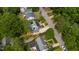 An aerial view shows the home with solar panels on the roof within a neighborhood at 2811 Van Dyke Ave, Raleigh, NC 27607