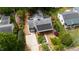 Aerial view of home featuring solar panels, manicured landscaping, and a spacious driveway at 2811 Van Dyke Ave, Raleigh, NC 27607