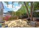 The back deck overlooks a lush, fenced backyard with beautiful flowering trees, providing a serene outdoor space at 2811 Van Dyke Ave, Raleigh, NC 27607