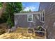 Back deck with a cozy seating area and charcoal grill, great for entertaining or quiet relaxation outside at 2811 Van Dyke Ave, Raleigh, NC 27607