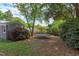 Spacious backyard with a trampoline and abundant greenery, perfect for outdoor activities and relaxation in nature at 2811 Van Dyke Ave, Raleigh, NC 27607