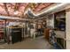 Unfinished basement featuring exposed ductwork, water heater, and workshop area with tools at 2811 Van Dyke Ave, Raleigh, NC 27607