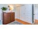 This is a well-organized bedroom features a dresser, closet, and hardwood floors at 2811 Van Dyke Ave, Raleigh, NC 27607