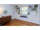 Cozy bedroom features custom built-in shelving, a window seat, and hardwood floors at 2811 Van Dyke Ave, Raleigh, NC 27607