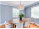 Bright dining room features hardwood floors, classic trim, and an elegant plant at 2811 Van Dyke Ave, Raleigh, NC 27607