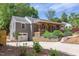 Charming home featuring a welcoming front porch, an attached garage, and a well-maintained, landscaped front yard at 2811 Van Dyke Ave, Raleigh, NC 27607