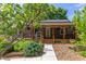 Charming home featuring a covered front porch, landscaped yard, and inviting entrance at 2811 Van Dyke Ave, Raleigh, NC 27607