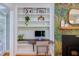 Home office with built-in shelving, and a wooden desk at 2811 Van Dyke Ave, Raleigh, NC 27607