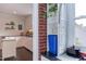 View into the kitchen, displaying white cabinets and modern appliances at 2811 Van Dyke Ave, Raleigh, NC 27607