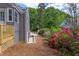 Well-maintained side yard with beautiful landscaping, offering a serene and inviting outdoor space near the deck at 2811 Van Dyke Ave, Raleigh, NC 27607