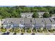 Aerial shot showcasing the townhouse community with mature trees and manicured lawns at 2821 Wilshire Hill Dr # 111, Raleigh, NC 27604