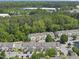 An aerial view of a well-maintained residential community surrounded by trees at 2821 Wilshire Hill Dr # 111, Raleigh, NC 27604