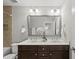 Bathroom with double vanity, large mirror, and decorative lighting at 2821 Wilshire Hill Dr # 111, Raleigh, NC 27604