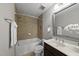 Bathroom with bathtub, tiled shower, and a classic vanity sink at 2821 Wilshire Hill Dr # 111, Raleigh, NC 27604