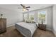 Bedroom featuring a neutral color scheme, ceiling fan, and large windows at 2821 Wilshire Hill Dr # 111, Raleigh, NC 27604