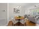 Cozy dining area with a round table, chandelier lighting, and seamless access to the living room at 2821 Wilshire Hill Dr # 111, Raleigh, NC 27604