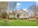 Charming exterior of the home with manicured lawn and a welcoming entrance at 2821 Wilshire Hill Dr # 111, Raleigh, NC 27604