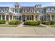Charming townhome featuring colorful shutters, a covered porch, and lovely front yard landscaping at 2821 Wilshire Hill Dr # 111, Raleigh, NC 27604