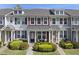 Charming townhome with inviting front porch and manicured landscaping showcasing a cozy curb appeal at 2821 Wilshire Hill Dr # 111, Raleigh, NC 27604
