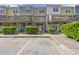 Rear exterior view of townhomes with balconies and well-maintained landscaping at 2821 Wilshire Hill Dr # 111, Raleigh, NC 27604