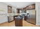 Modern kitchen with stainless steel appliances, granite countertops, and ample cabinet space at 2821 Wilshire Hill Dr # 111, Raleigh, NC 27604
