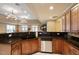Kitchen with granite countertops, stainless steel appliances, and wooden cabinets at 2821 Wilshire Hill Dr # 111, Raleigh, NC 27604