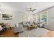 Open-concept living area featuring stylish furnishings, hardwood floors, and plenty of natural light at 2821 Wilshire Hill Dr # 111, Raleigh, NC 27604