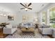 Bright living room featuring neutral tones, stylish decor, and a large window for natural light at 2821 Wilshire Hill Dr # 111, Raleigh, NC 27604