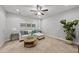 Inviting living room featuring a sectional sofa, round table, and plant, perfect for relaxation at 2821 Wilshire Hill Dr # 111, Raleigh, NC 27604