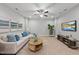 Cozy living room with a plush sectional sofa, round coffee table, TV, and nature-themed decor at 2821 Wilshire Hill Dr # 111, Raleigh, NC 27604